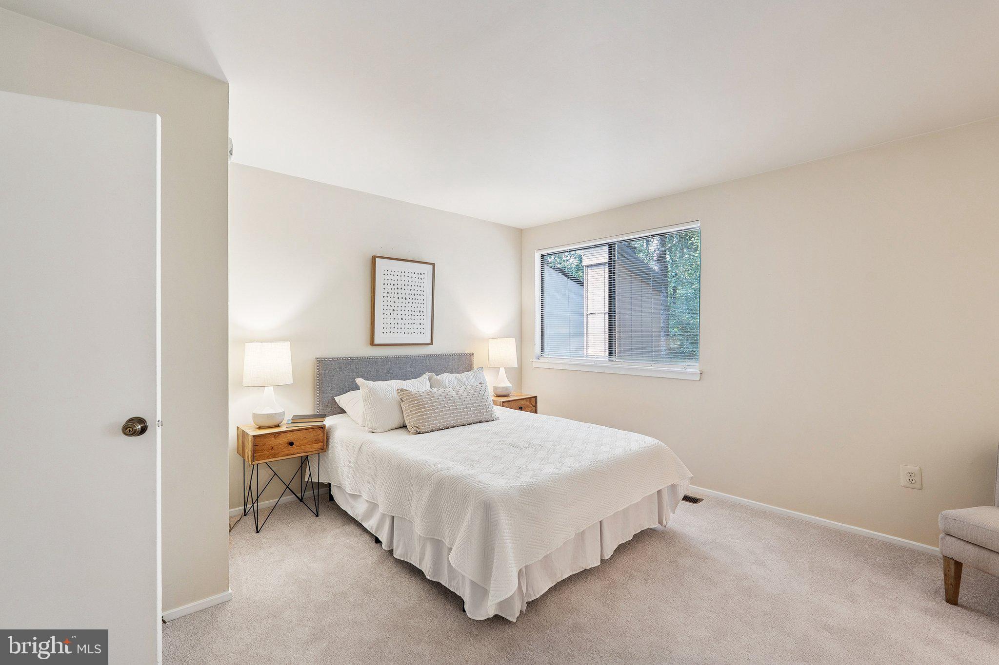 2343 Glade Bank Way Reston, VA 20191 - Photo 19 of 38 a bedroom with a bed and a window