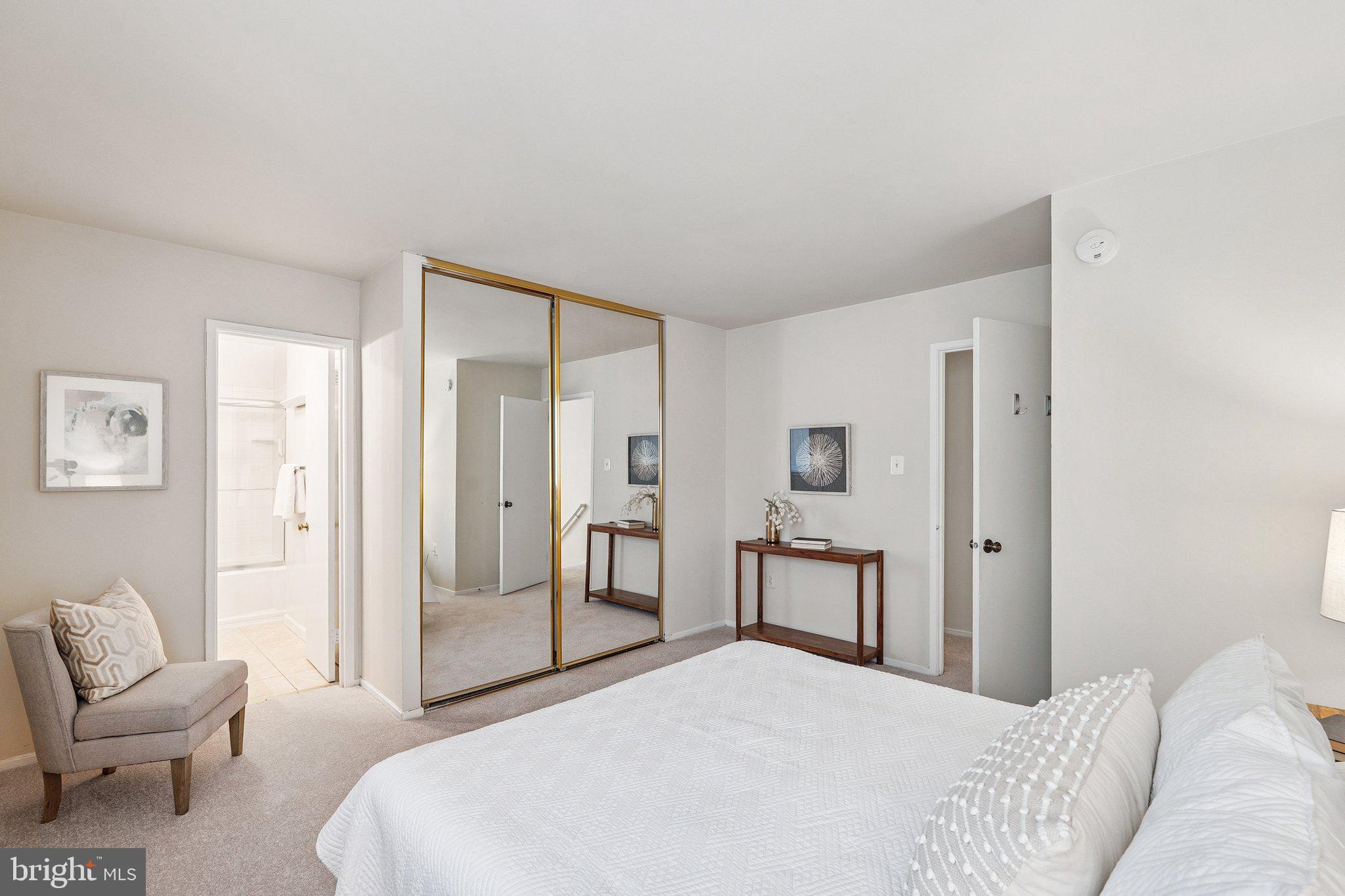 2343 Glade Bank Way Reston, VA 20191 - Photo 21 of 38 a bedroom with a bed and a chair