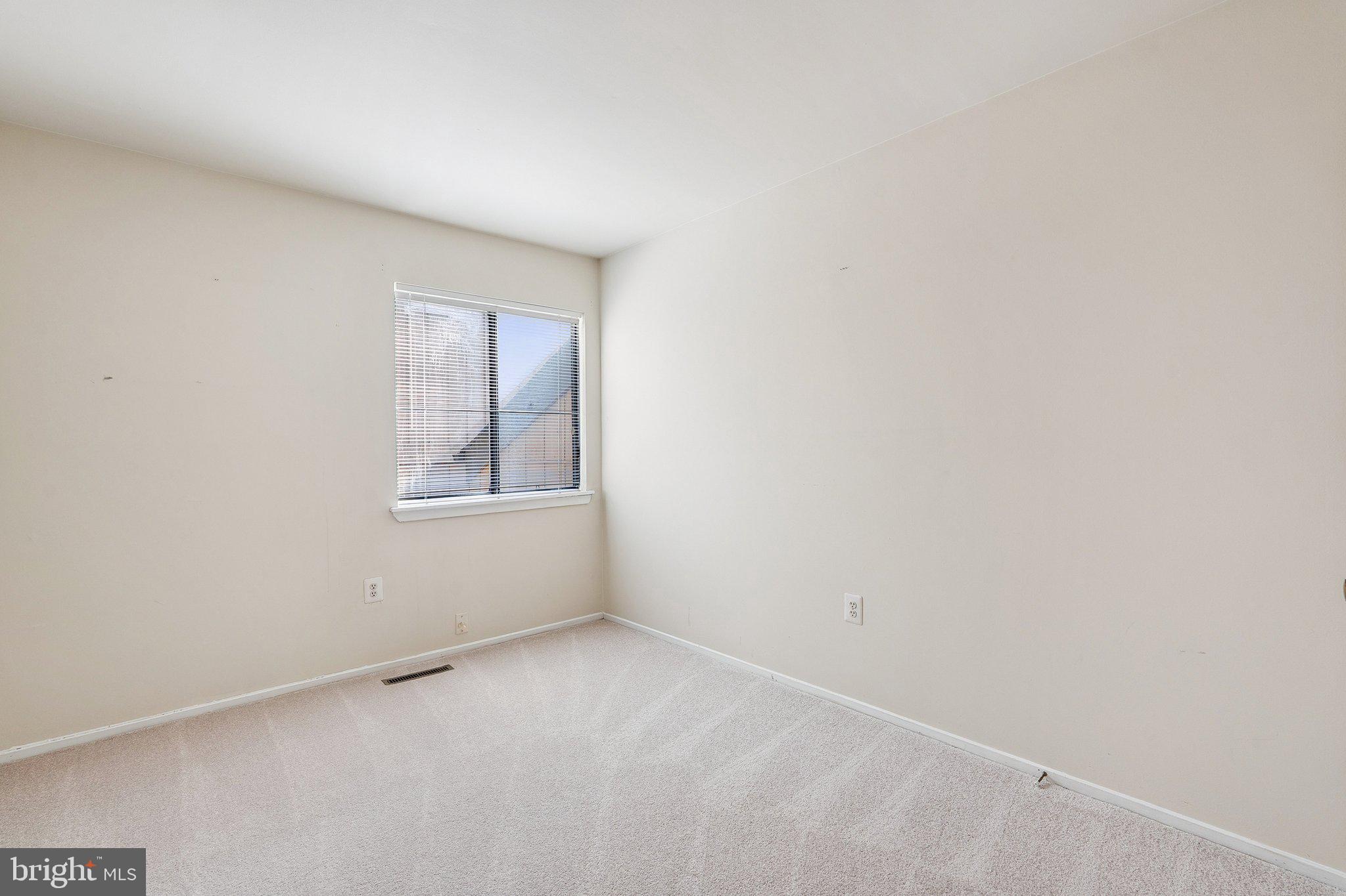 2343 Glade Bank Way Reston, VA 20191 - Photo 23 of 38 a view of an empty room with a window