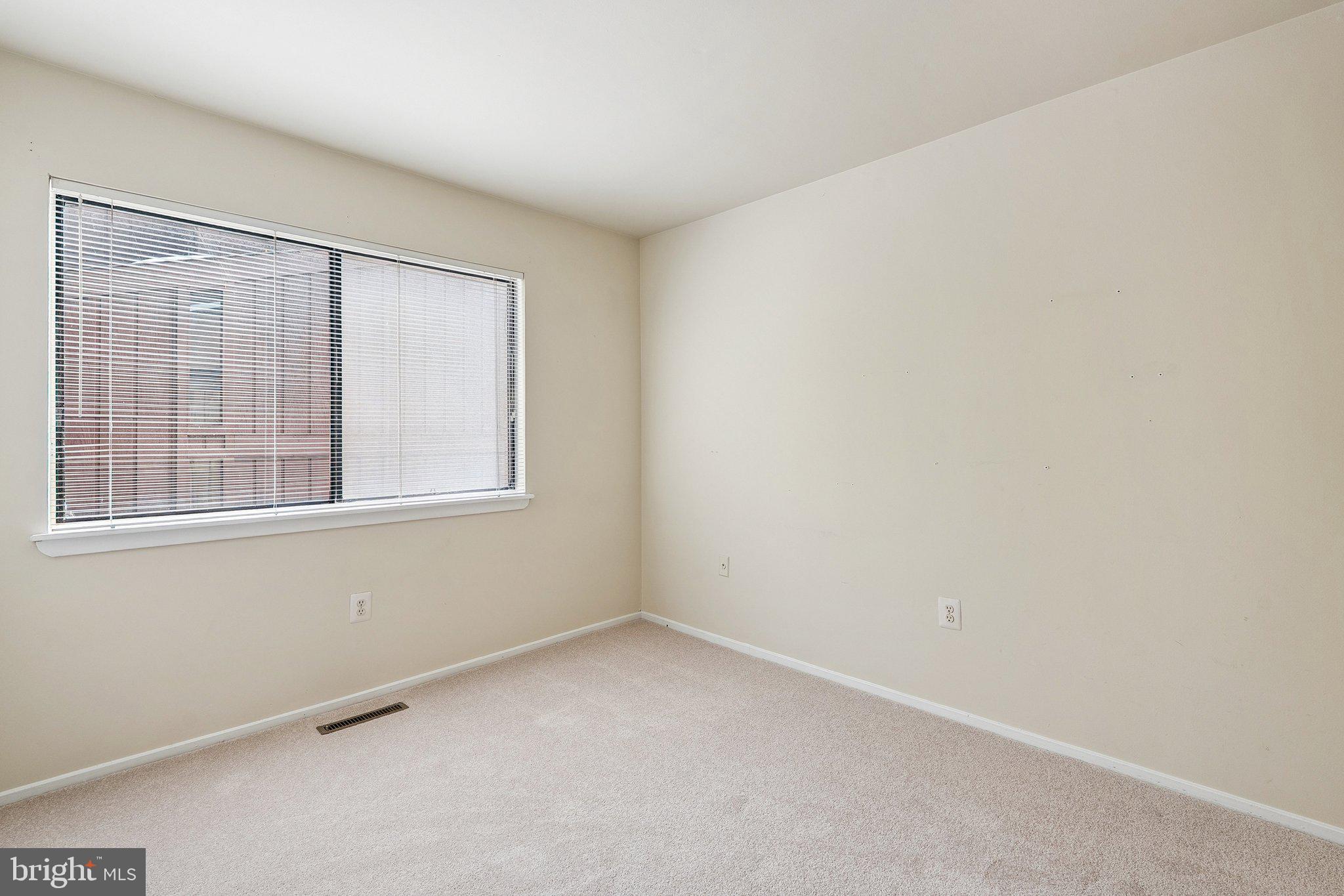 2343 Glade Bank Way Reston, VA 20191 - Photo 25 of 38 a view of an empty room with a window