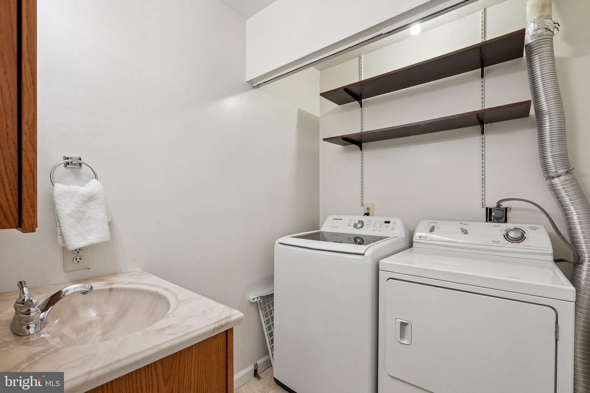 2343 Glade Bank Way Reston, VA 20191 - Photo 28 of 38 a utility room with dryer and washer
