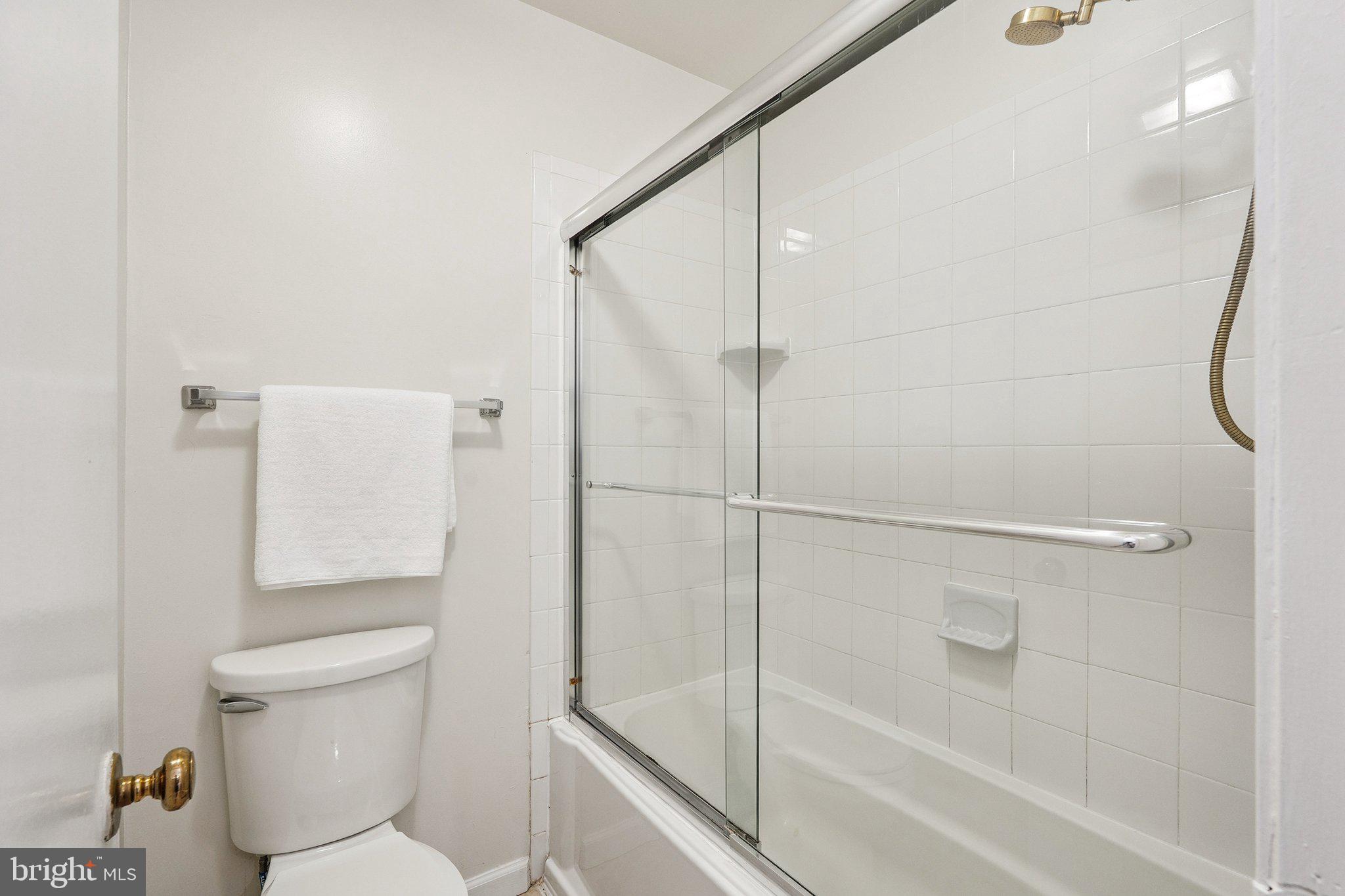 2343 Glade Bank Way Reston, VA 20191 - Photo 29 of 38 a bathroom with a shower and a toilet