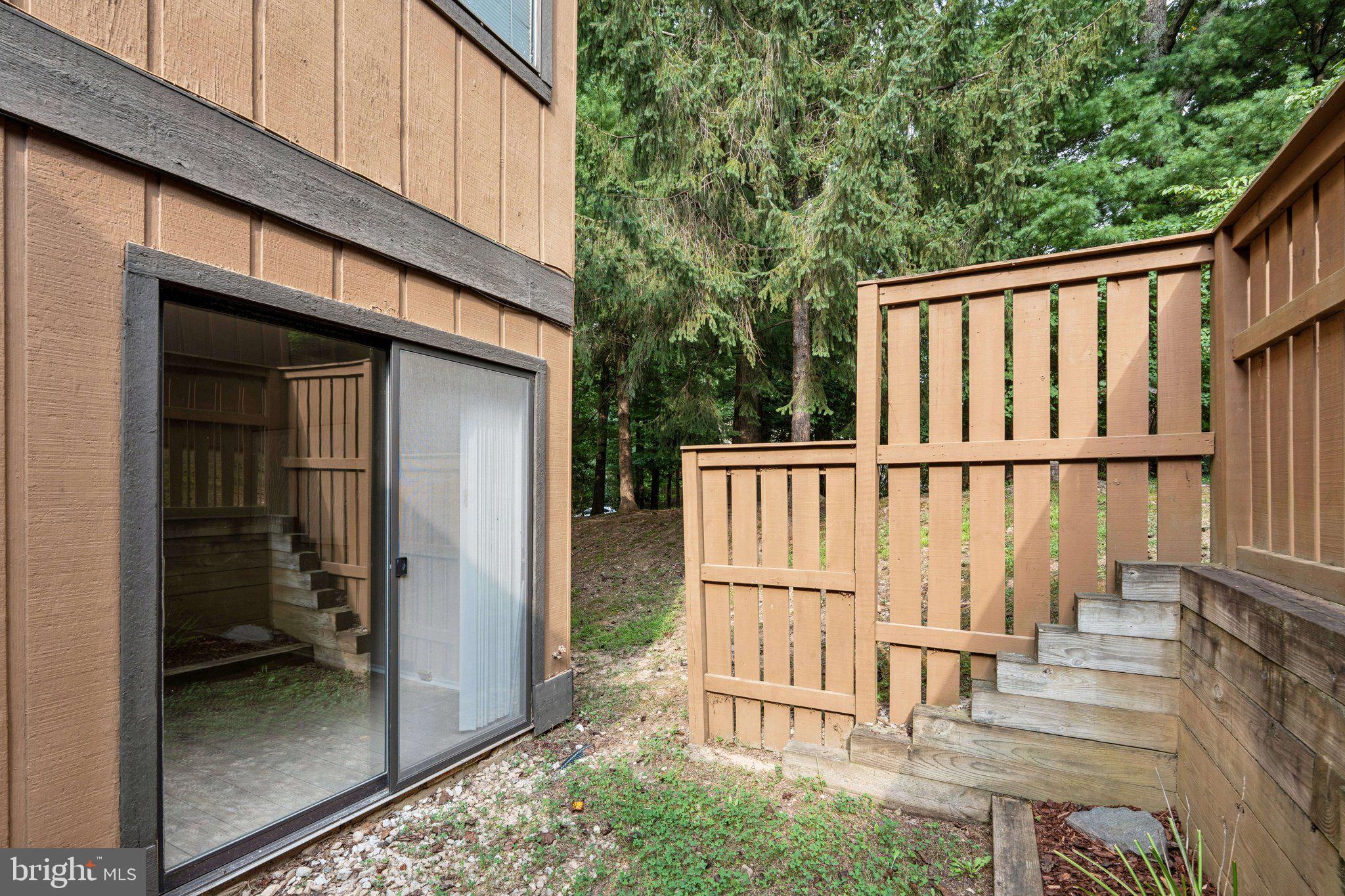 2343 Glade Bank Way Reston, VA 20191 - Photo 32 of 38 a view of a balcony with wooden fence and floor