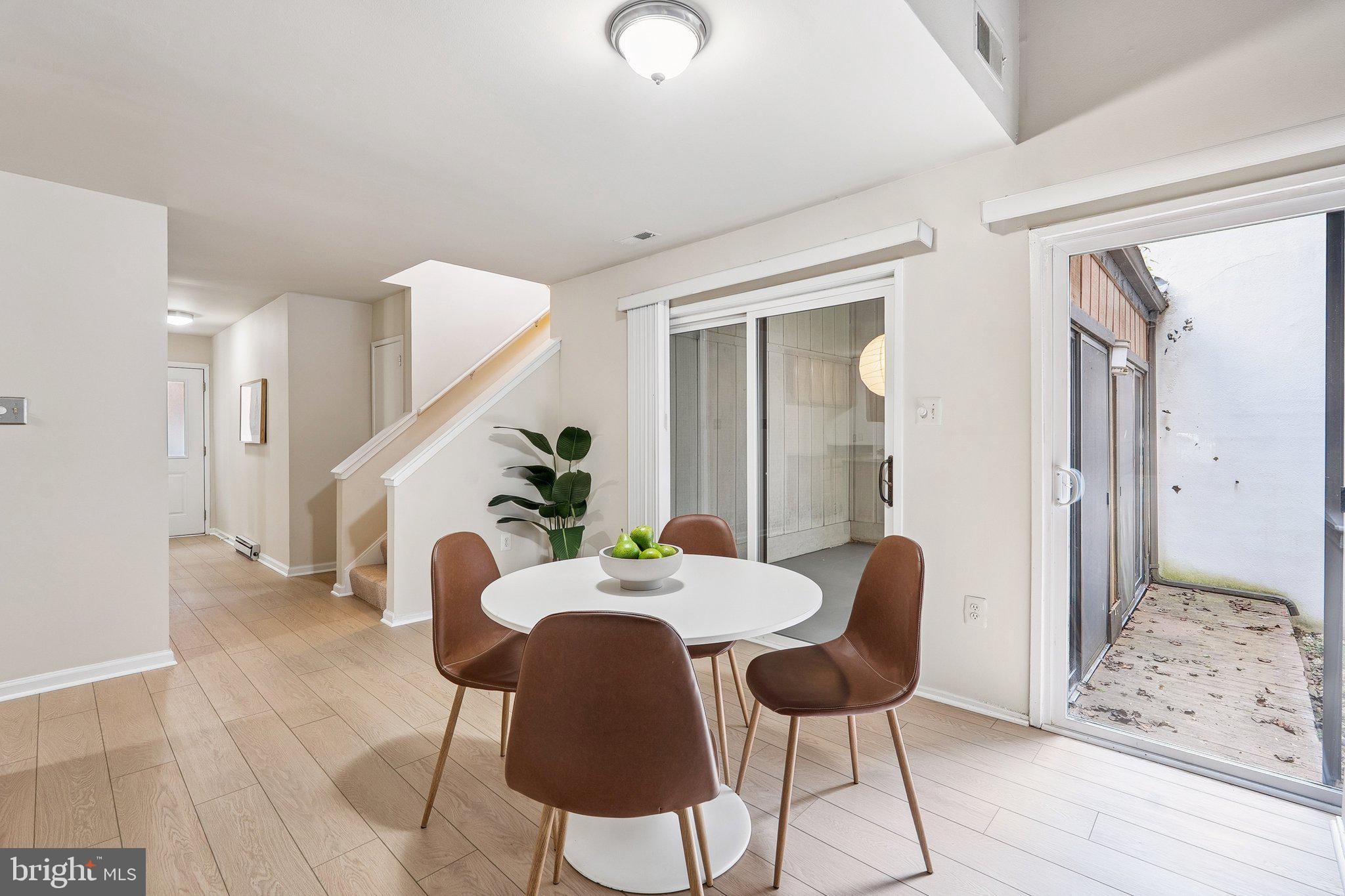 2343 Glade Bank Way Reston, VA 20191 - Photo 10 of 38 a view of a dining room with furniture and wooden floor