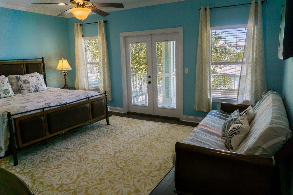 4554 Biscayne Way Destin, FL 32541 - Photo 15 of 33 a bedroom with a bed and window