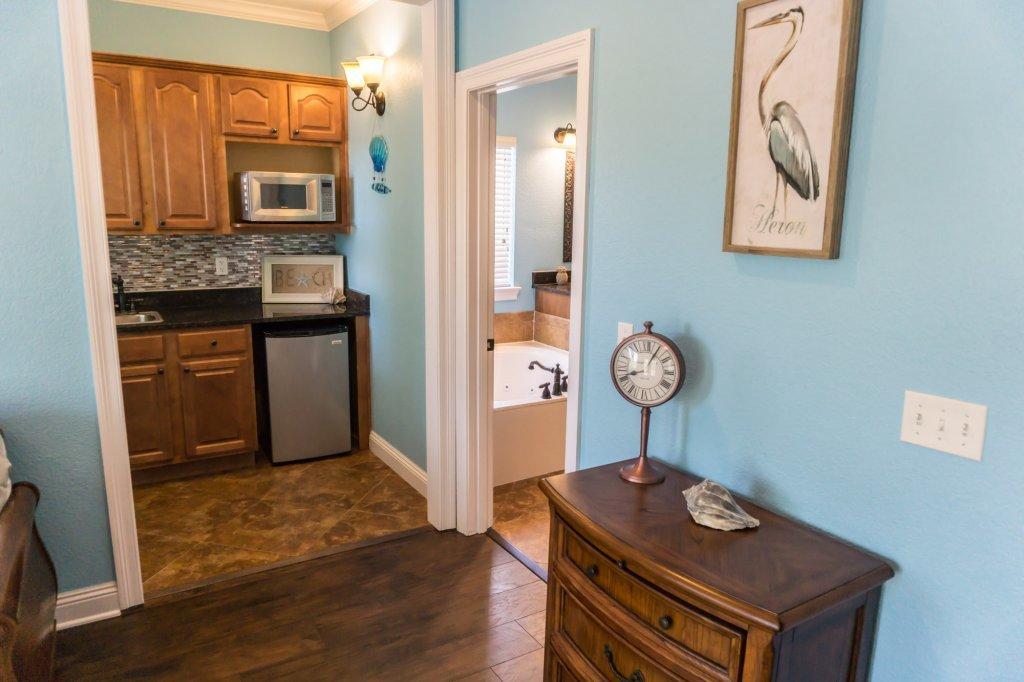 4554 Biscayne Way Destin, FL 32541 - Photo 16 of 33 a view of kitchen with cabinets and wooden floor