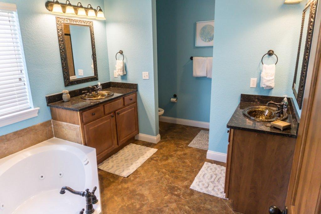 4554 Biscayne Way Destin, FL 32541 - Photo 17 of 33 a kitchen with granite countertop a stove and a sink