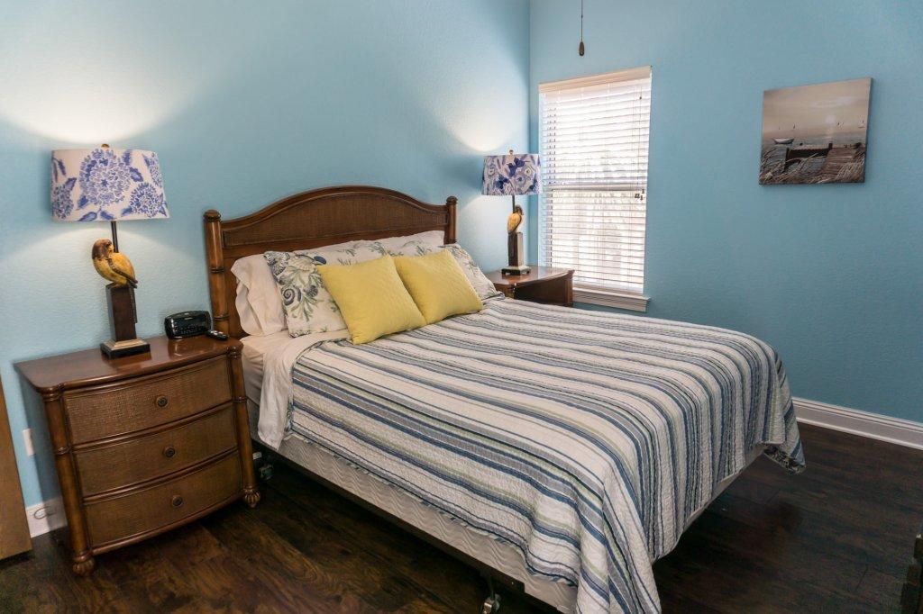4554 Biscayne Way Destin, FL 32541 - Photo 20 of 33 a bedroom with a bed and window