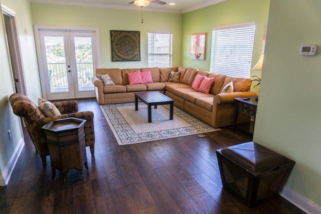 4554 Biscayne Way Destin, FL 32541 - Photo 22 of 33 a living room with furniture and a flat screen tv