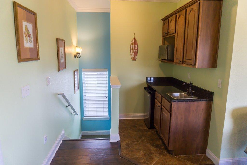 4554 Biscayne Way Destin, FL 32541 - Photo 23 of 33 a utility room with wooden floor washer and dryer