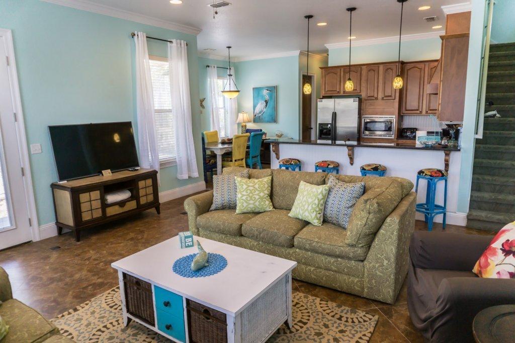 4554 Biscayne Way Destin, FL 32541 - Photo 33 of 33 a living room with furniture and a flat screen tv