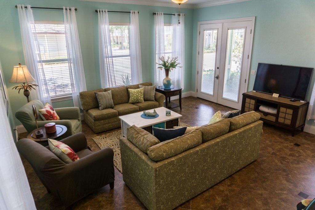 4554 Biscayne Way Destin, FL 32541 - Photo 7 of 33 a living room with furniture and a flat screen tv