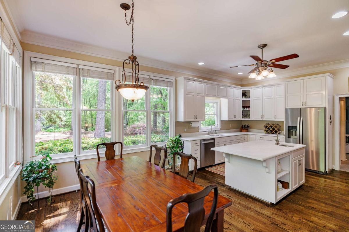835 Timothy Road Athens, GA 30606 - Photo 14 of 65 a view of a dining room with furniture window and wooden floor