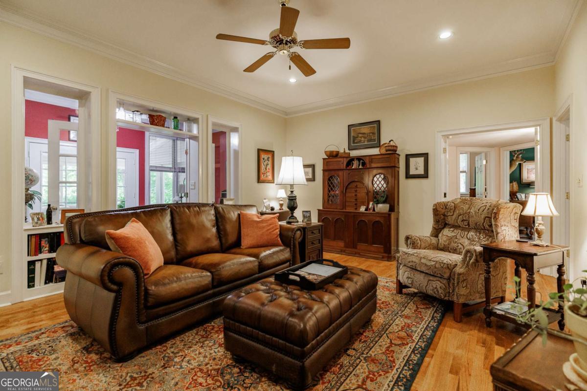 835 Timothy Road Athens, GA 30606 - Photo 23 of 65 a living room with furniture ceiling fan and a rug
