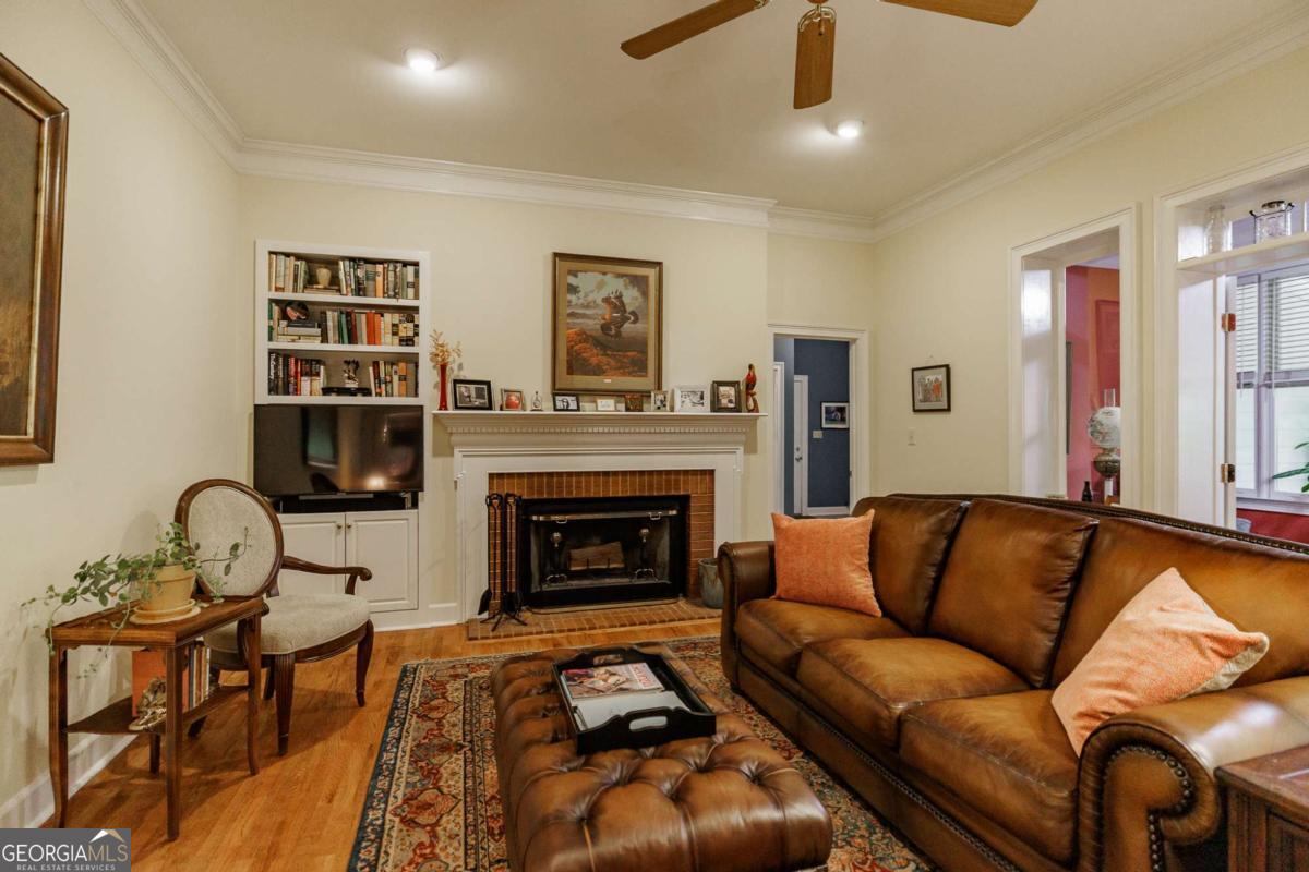 835 Timothy Road Athens, GA 30606 - Photo 26 of 65 a living room with furniture and a fireplace