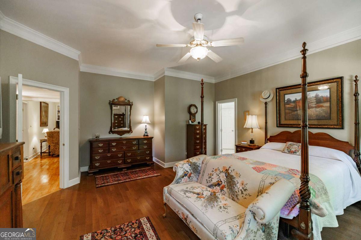 835 Timothy Road Athens, GA 30606 - Photo 33 of 65 a bedroom with a bed and wooden floor