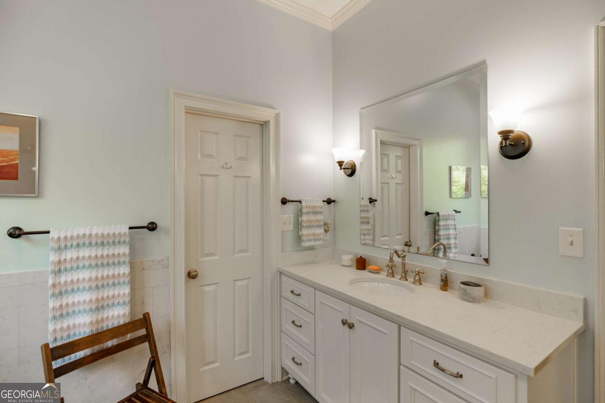 835 Timothy Road Athens, GA 30606 - Photo 39 of 65 a bathroom with a sink a mirror and shower