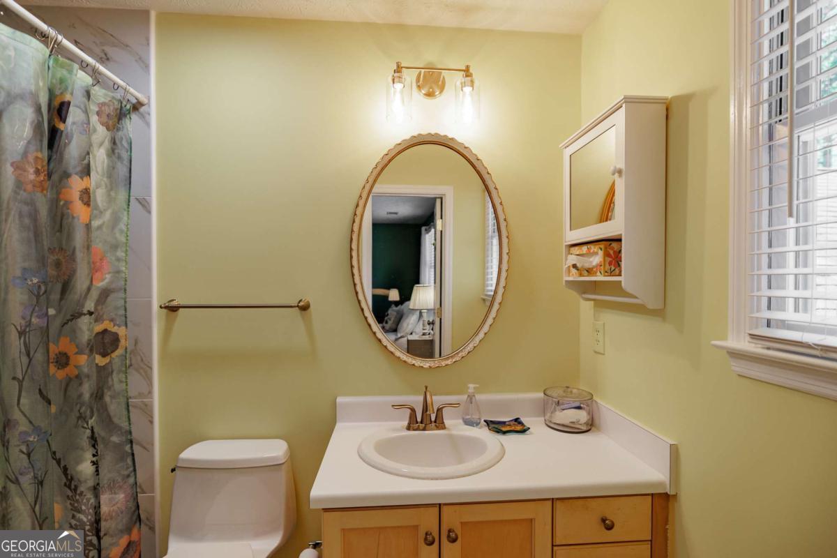 835 Timothy Road Athens, GA 30606 - Photo 43 of 65 a bathroom with a sink and a mirror