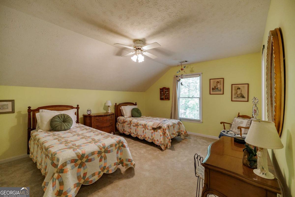 835 Timothy Road Athens, GA 30606 - Photo 44 of 65 a bedroom with two beds and painting on the wall