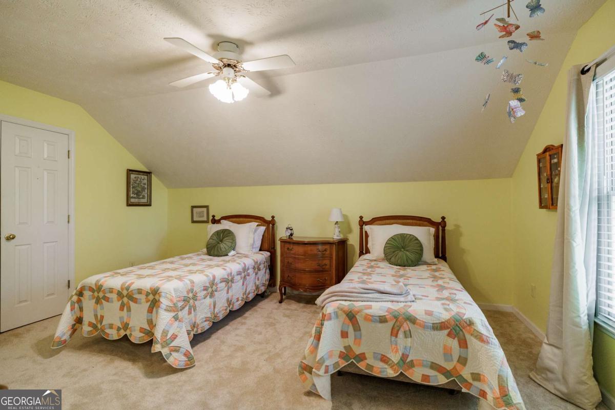 835 Timothy Road Athens, GA 30606 - Photo 45 of 65 a bedroom with two beds and ceiling fan