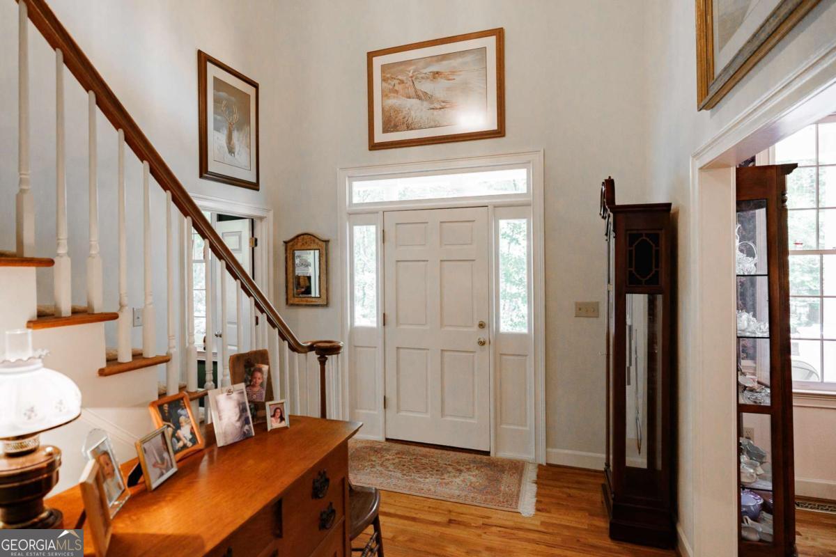 835 Timothy Road Athens, GA 30606 - Photo 6 of 65 a view of an entryway with wooden floor and stairs