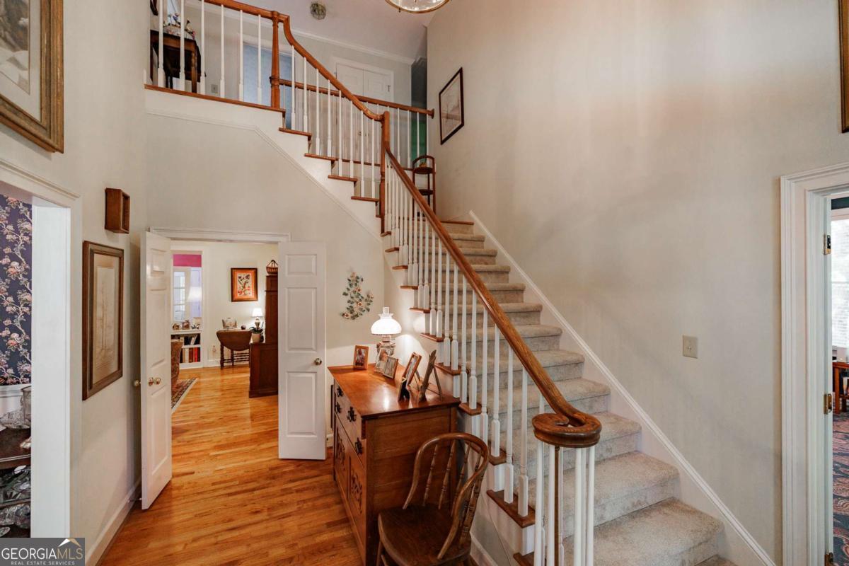 835 Timothy Road Athens, GA 30606 - Photo 7 of 65 a view of entryway and hall with wooden floor