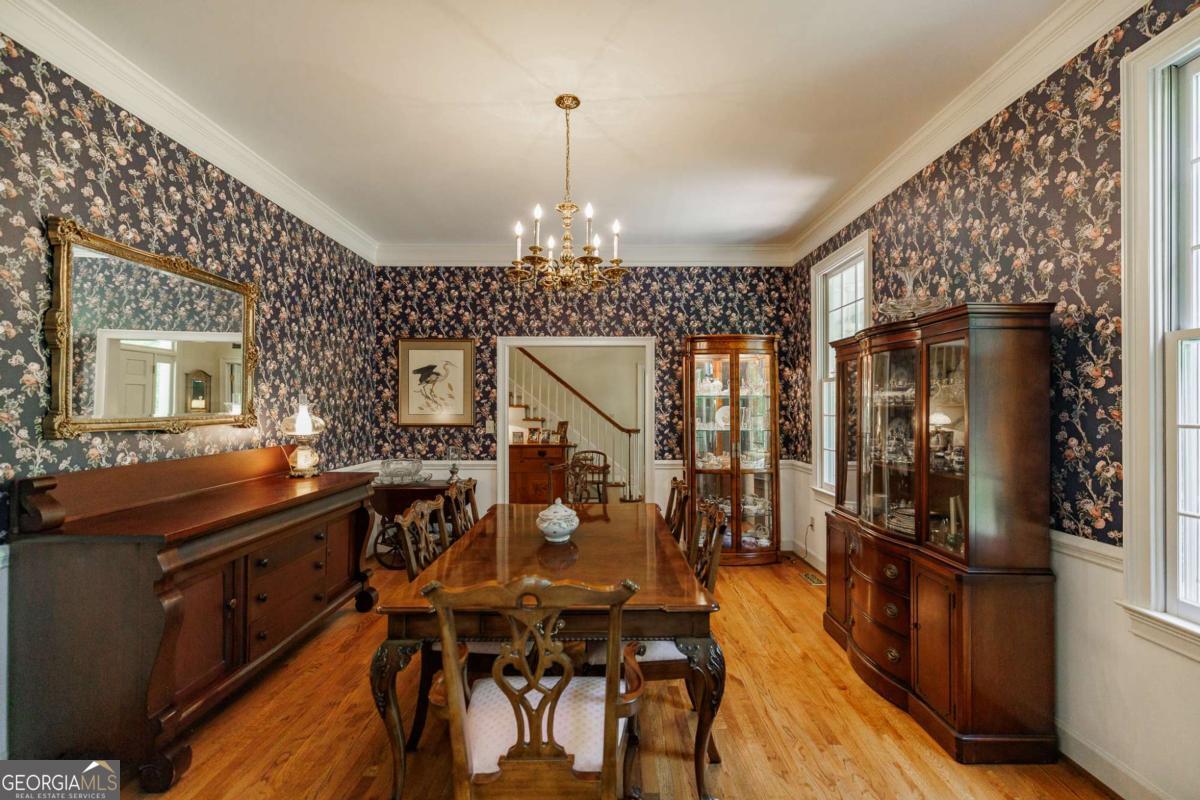 835 Timothy Road Athens, GA 30606 - Photo 10 of 65 a view of a dining room with furniture window and wooden floor