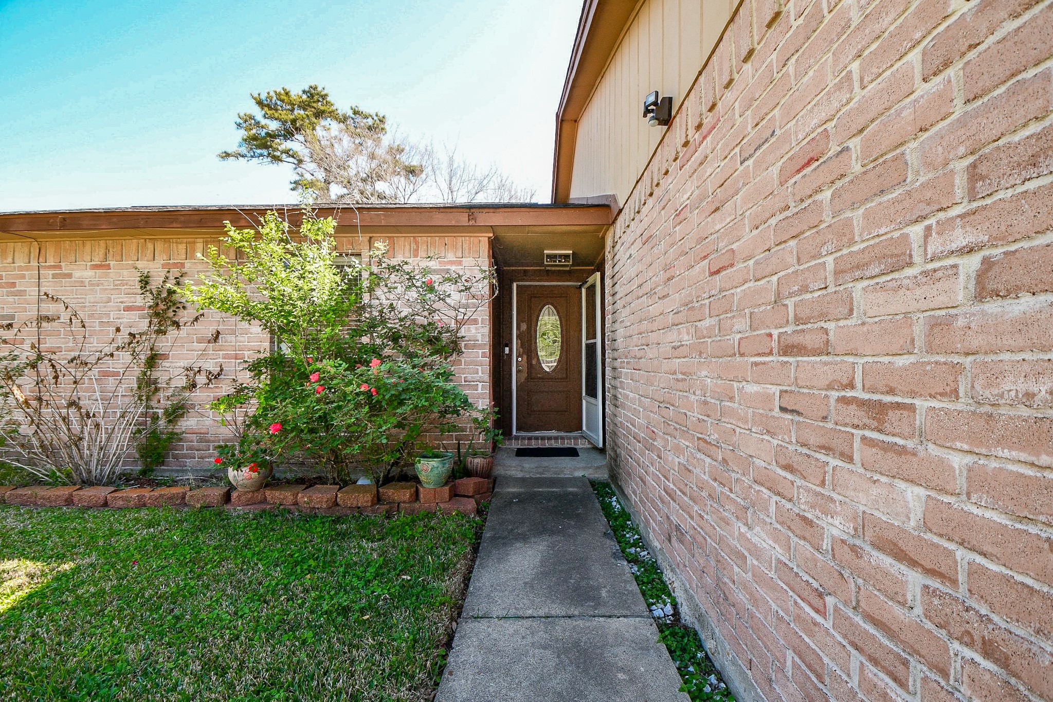 16711 Ribbonridge Drive Sugar Land, TX 77498 - Photo 5 of 24 a front view of a house with a garden