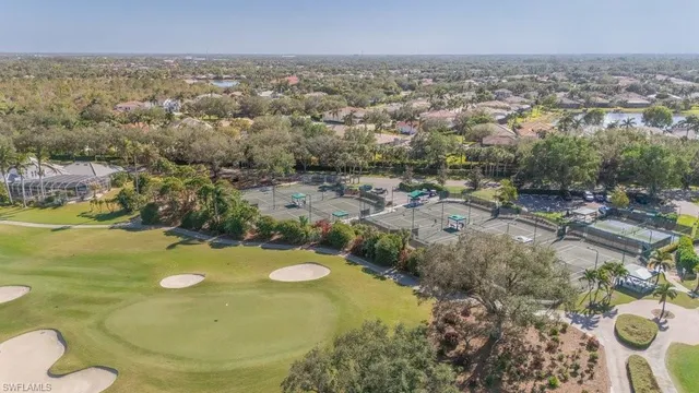 an aerial view of a residential houses with outdoor space