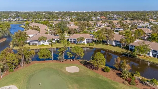 an aerial view of a residential houses with outdoor space and swimming pool