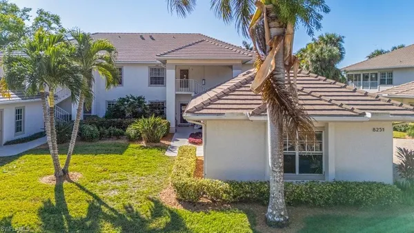 a view of an house with backyard porch and swimming pool