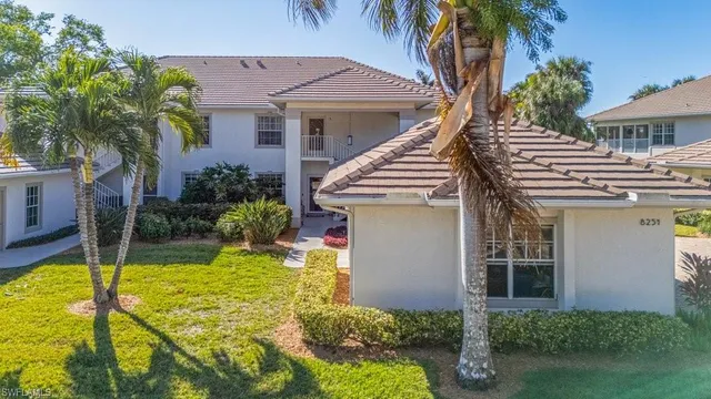 a view of an house with backyard porch and swimming pool