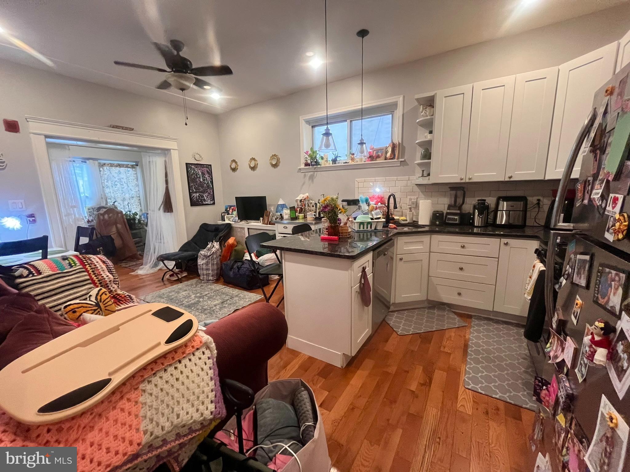 5028 Walnut Street, Unit 1F Philadelphia, PA 19139 - Photo 11 of 32 a kitchen that has a lot of cabinets and appliances