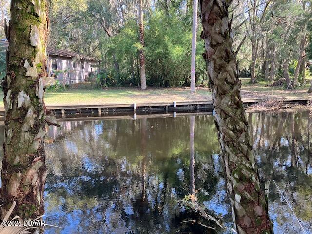 0 Shell Harbor Road Pierson, FL 32180 - Photo 4 of 8 a view of a lake with a house in the background