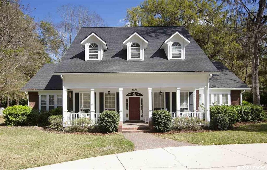 3821 Southwest 78th Street Gainesville, FL 32608 - Photo 1 of 1 front view of a house with a yard