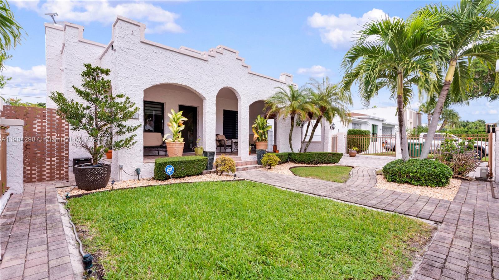 2271 Southwest 25th Street, Unit 2271 Miami, FL 33133 - Photo 1 of 39 a view of a house with a yard and plants