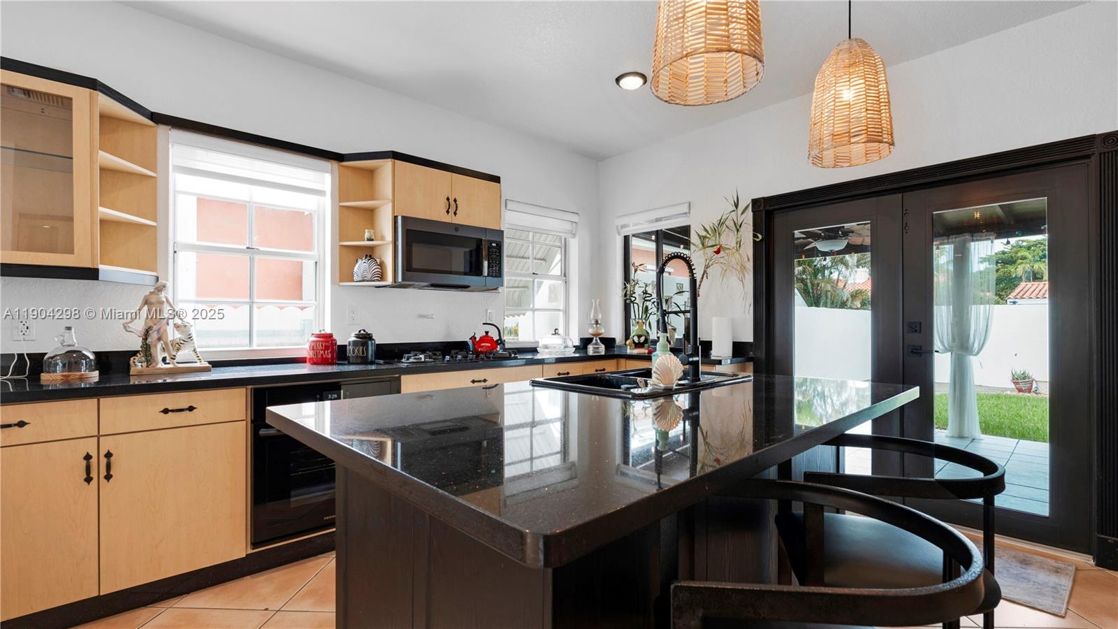 2271 Southwest 25th Street, Unit 2271 Miami, FL 33133 - Photo 12 of 39 a kitchen with a sink stove and microwave