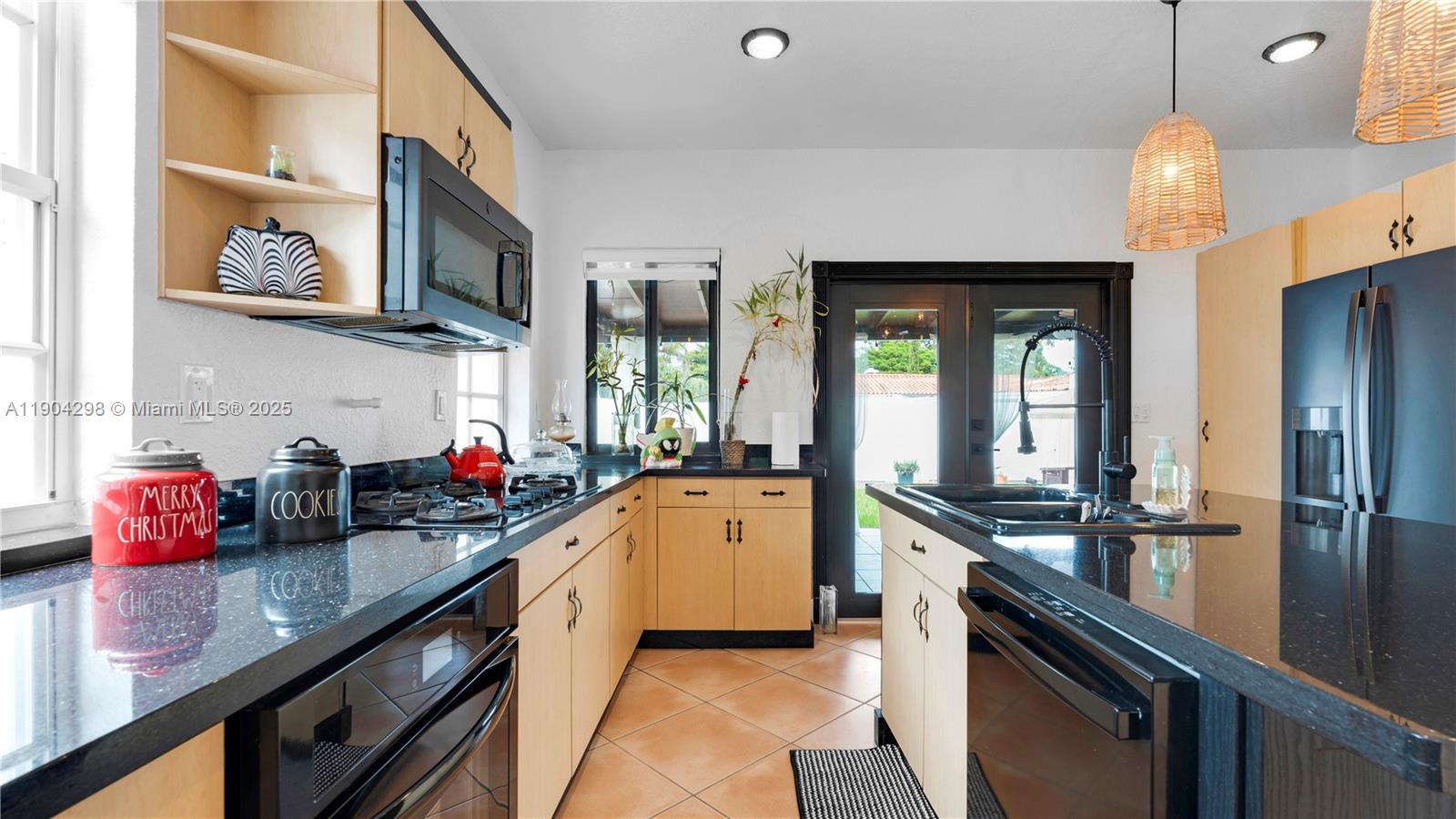 2271 Southwest 25th Street, Unit 2271 Miami, FL 33133 - Photo 14 of 39 a kitchen with a sink stove and microwave