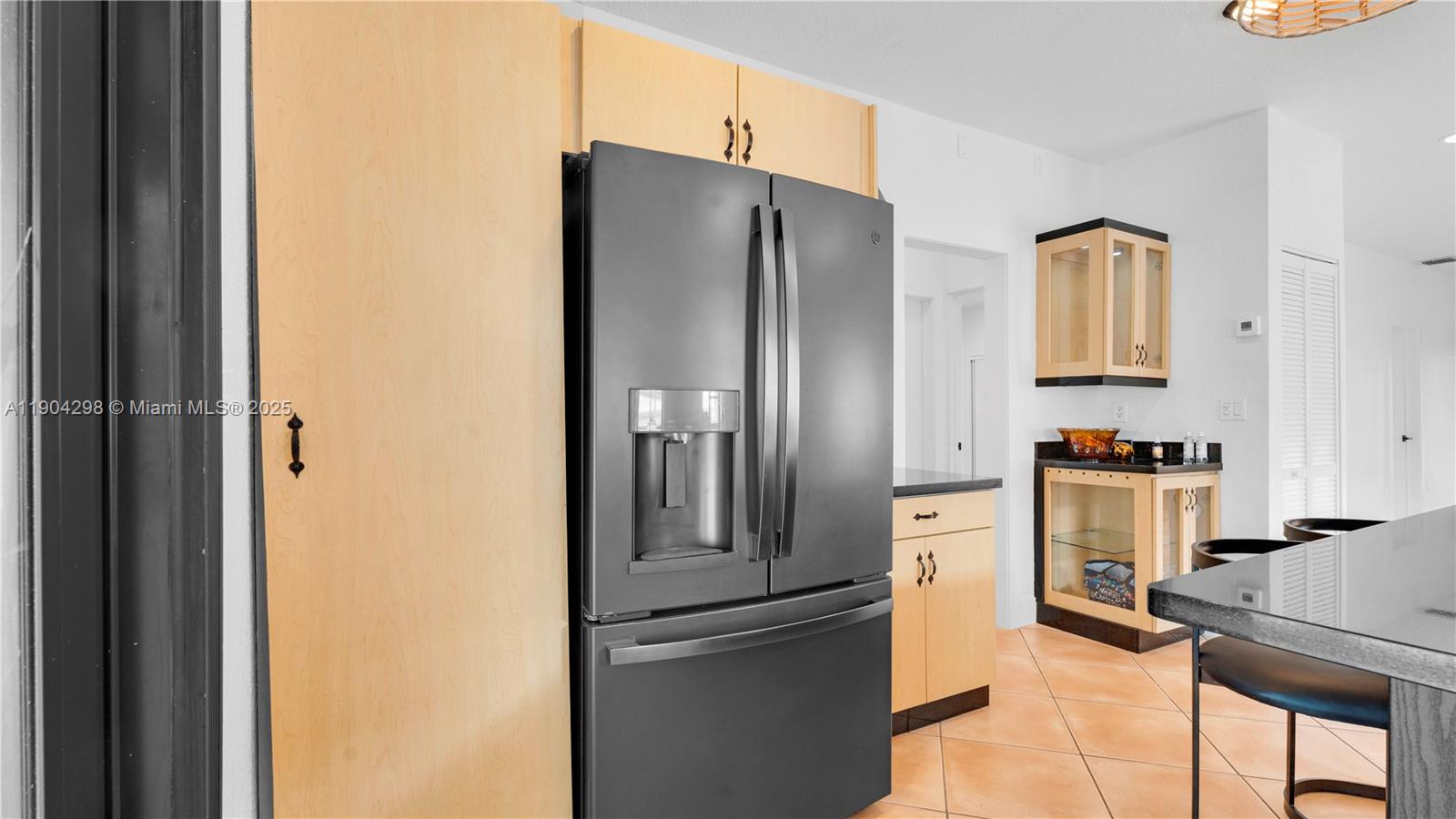 2271 Southwest 25th Street, Unit 2271 Miami, FL 33133 - Photo 16 of 39 a kitchen with stainless steel appliances granite countertop a refrigerator and a stove top oven