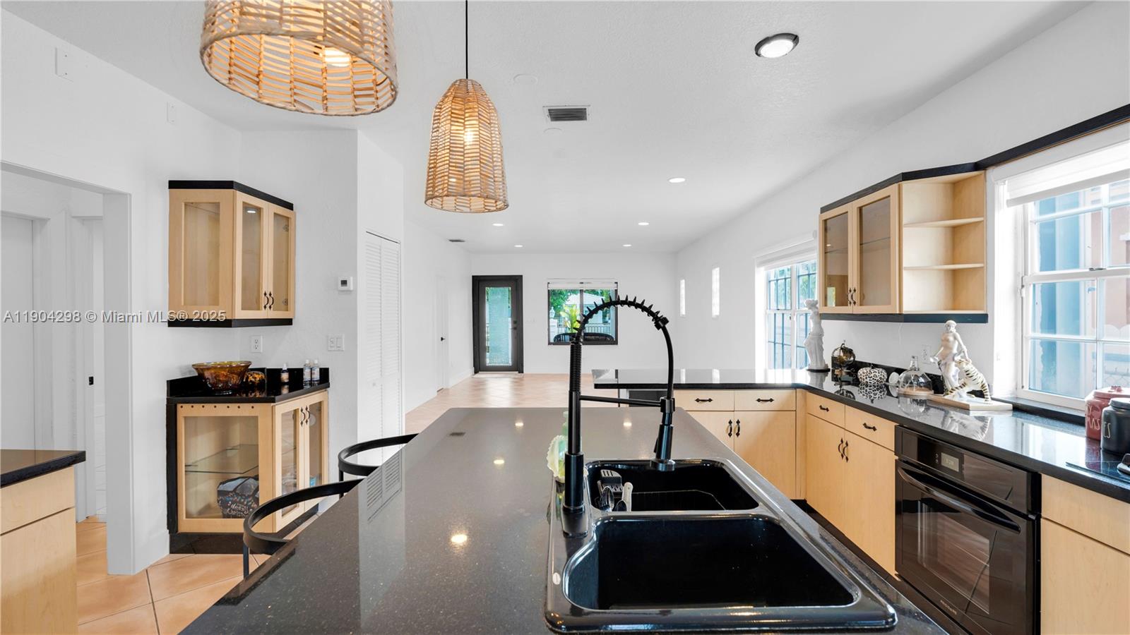 2271 Southwest 25th Street, Unit 2271 Miami, FL 33133 - Photo 17 of 39 a kitchen with a sink a stove and cabinets