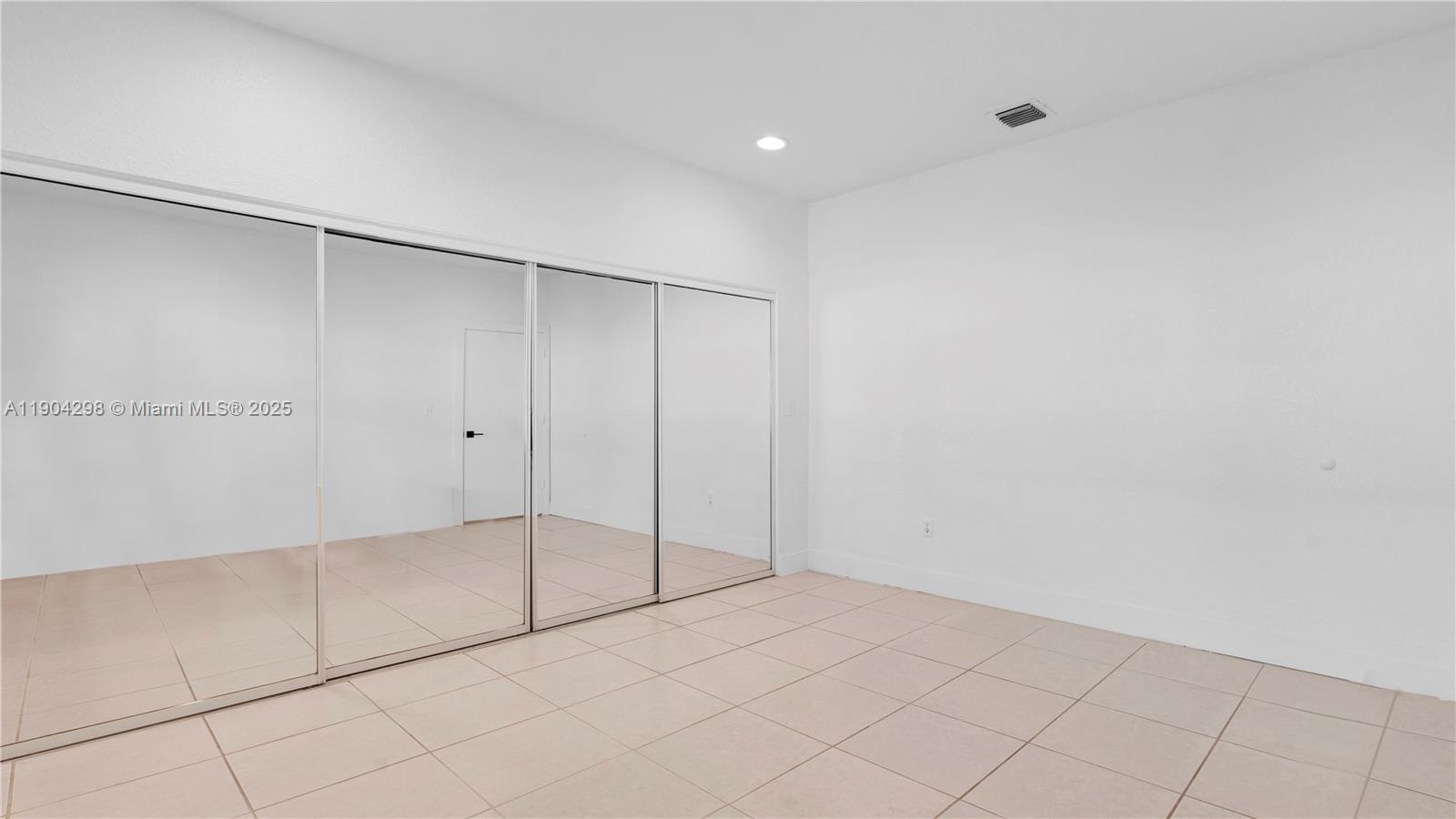 2271 Southwest 25th Street, Unit 2271 Miami, FL 33133 - Photo 22 of 39 a view of an empty room