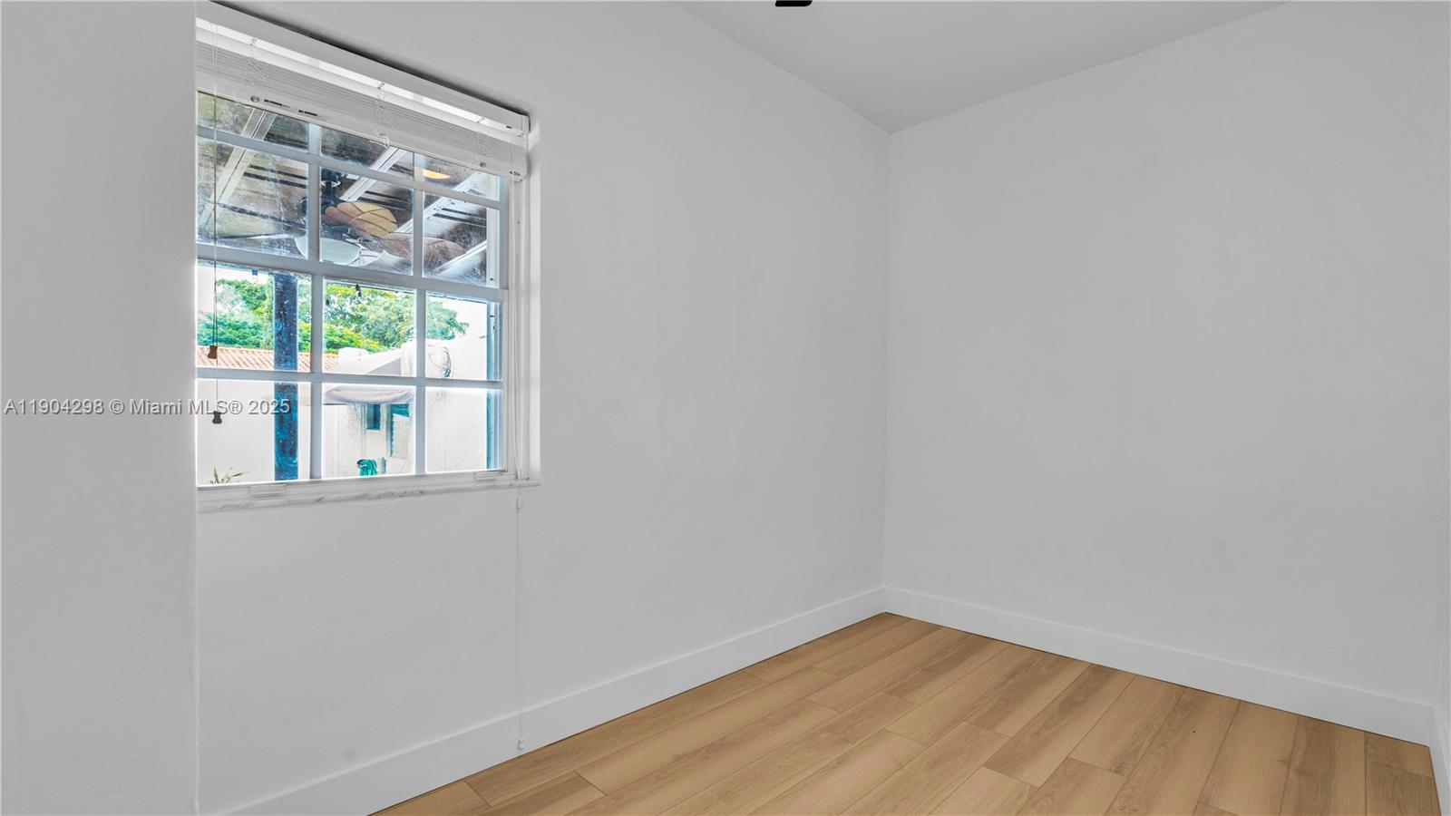 2271 Southwest 25th Street, Unit 2271 Miami, FL 33133 - Photo 24 of 39 a view of an empty room with a window