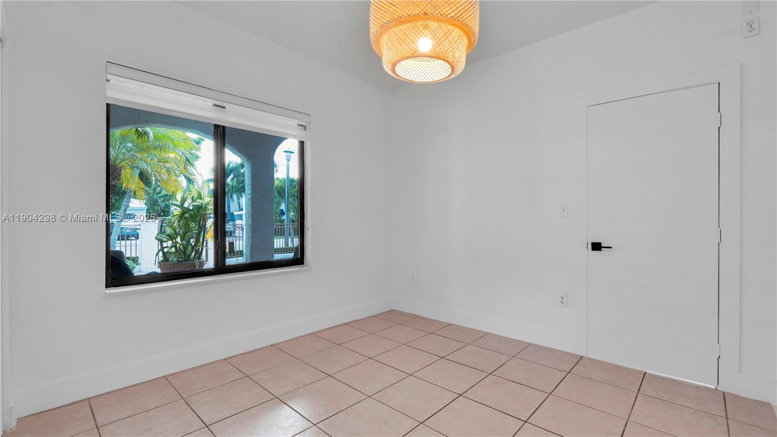 2271 Southwest 25th Street, Unit 2271 Miami, FL 33133 - Photo 29 of 39 an empty room with window