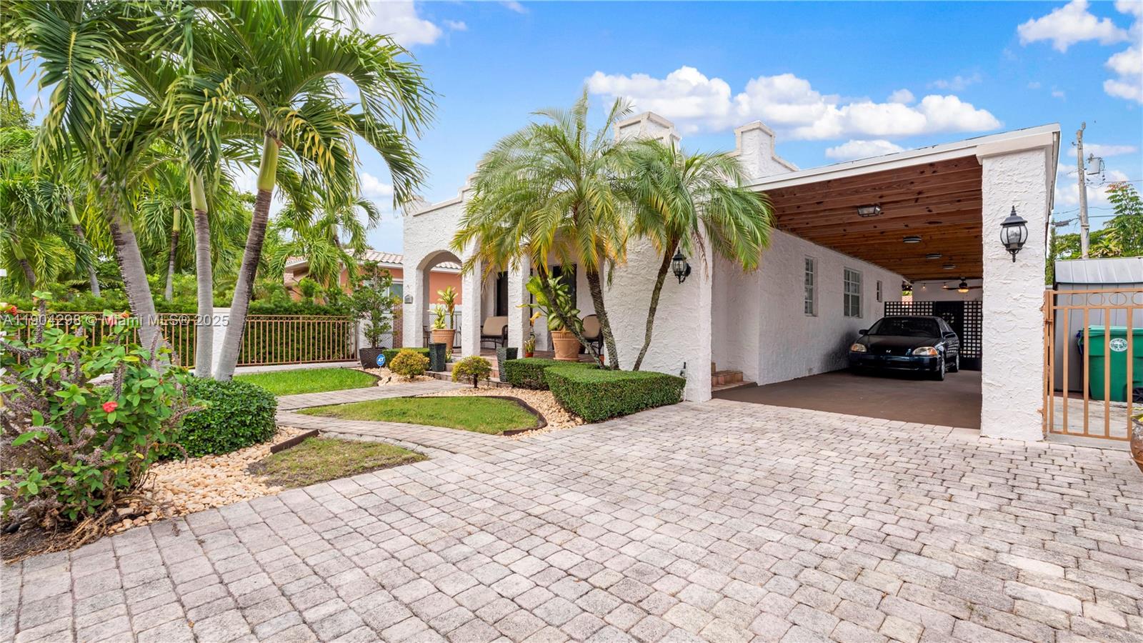 2271 Southwest 25th Street, Unit 2271 Miami, FL 33133 - Photo 3 of 39 a view of a white house with a patio