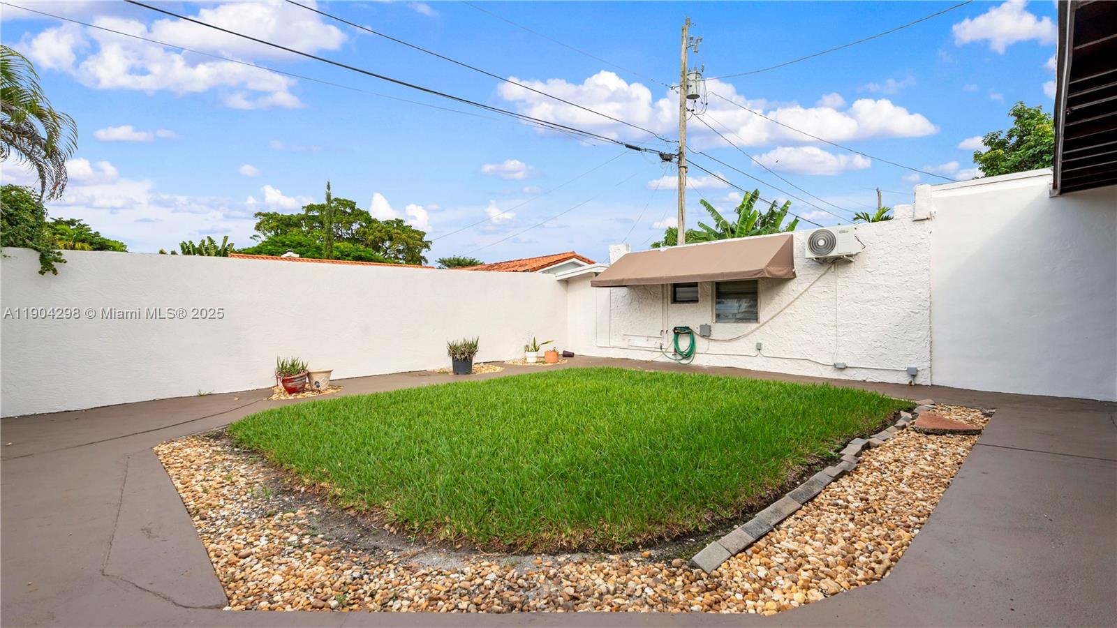2271 Southwest 25th Street, Unit 2271 Miami, FL 33133 - Photo 32 of 39 a view of a house with a backyard porch and sitting area