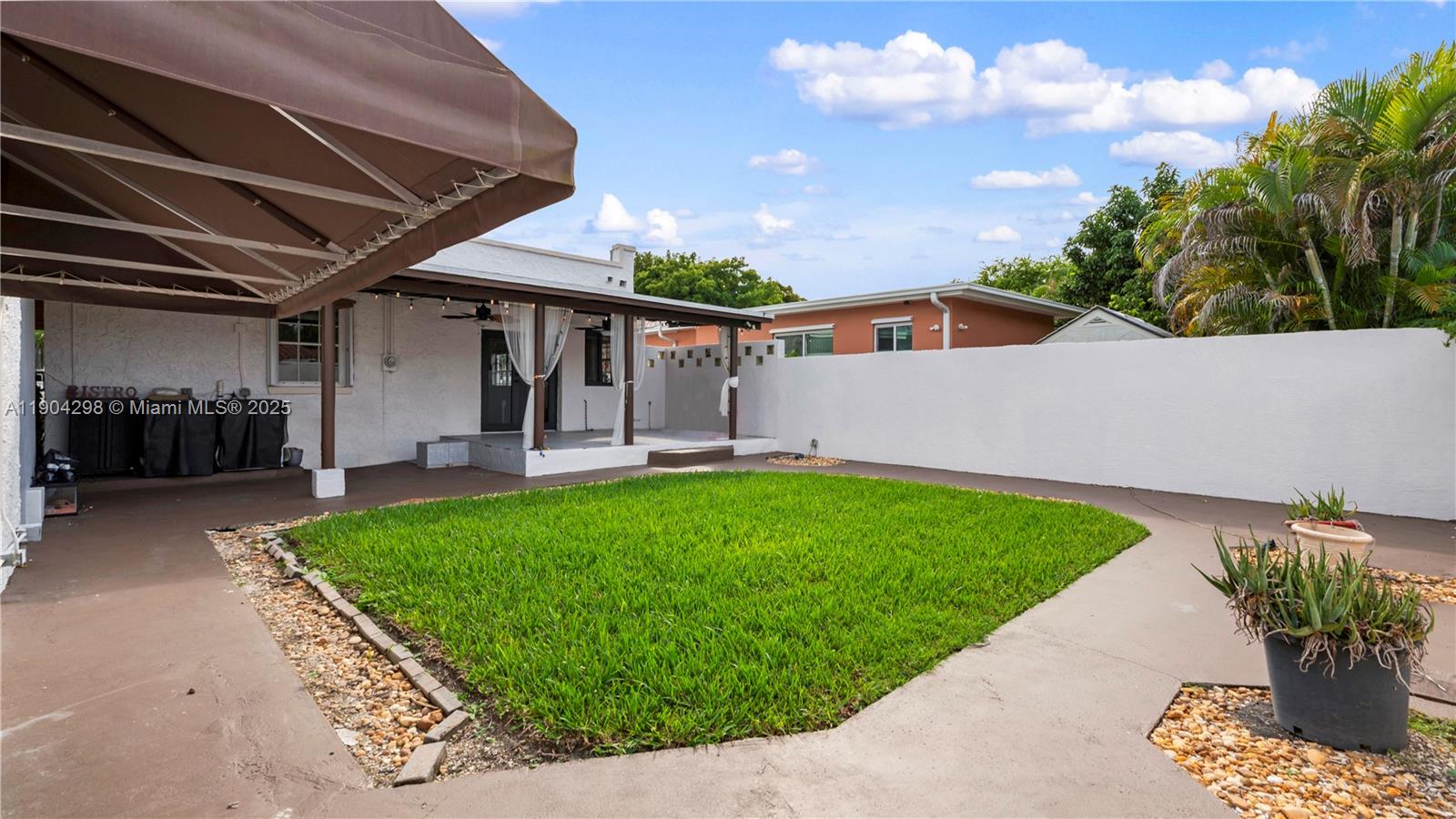 2271 Southwest 25th Street, Unit 2271 Miami, FL 33133 - Photo 33 of 39 a front view of a house with garden