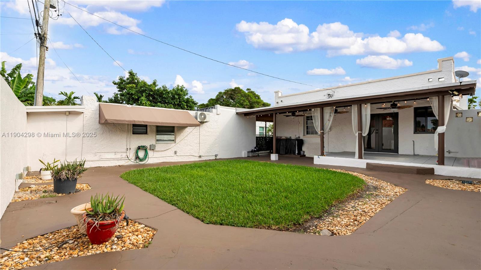 2271 Southwest 25th Street, Unit 2271 Miami, FL 33133 - Photo 34 of 39 a view of a backyard with sitting area