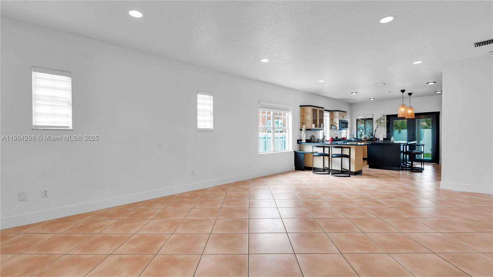 2271 Southwest 25th Street, Unit 2271 Miami, FL 33133 - Photo 9 of 39 a room with furniture and view of kitchen