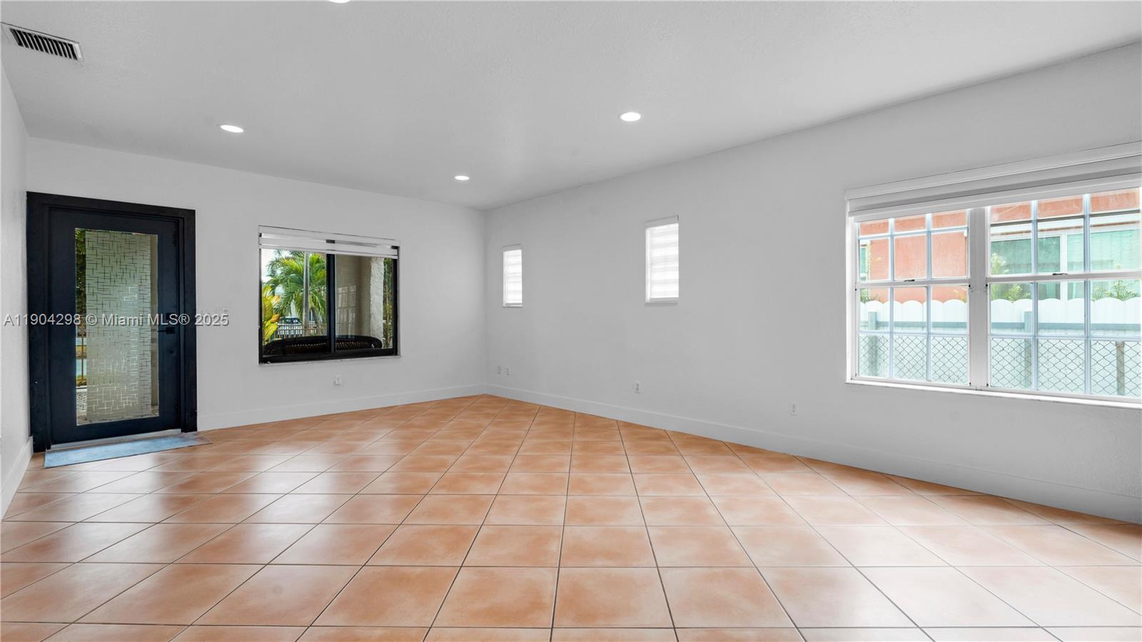 2271 Southwest 25th Street, Unit 2271 Miami, FL 33133 - Photo 10 of 39 a view of an empty room with a window