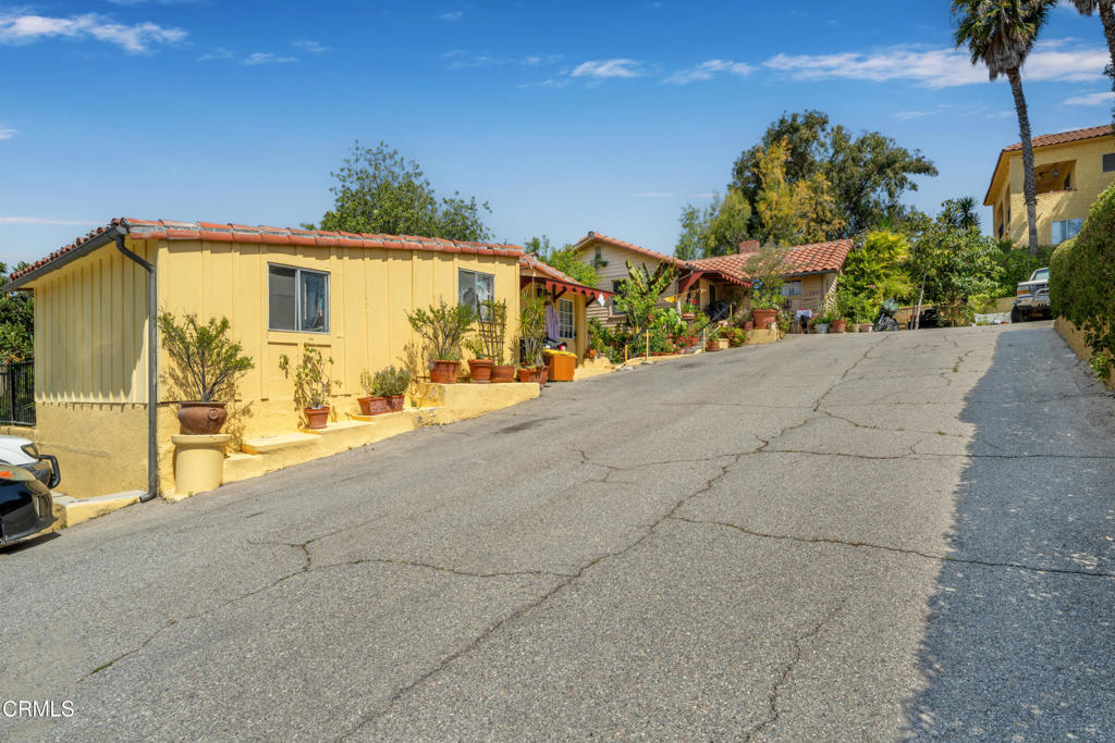 65 Wicks Road Moorpark, CA 93021 - Photo 11 of 21 a view of outdoor space garage and couple of cars parked on road